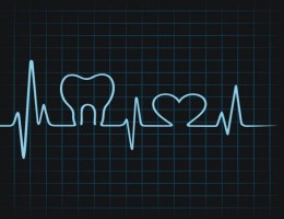 Lectura de electrocardiograma con muela y corazon